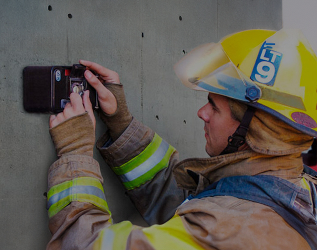 Fire Protection Systems, Security Systems, and Life Safety System Services in Midwest - a man installing security camera